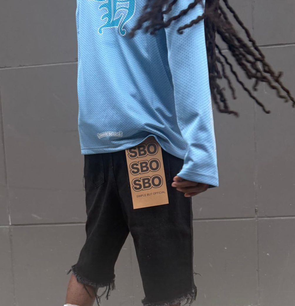 JET BLACK RIPPED BAGGY SHORTS